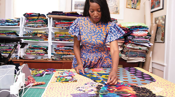 Person working on colorful art piece