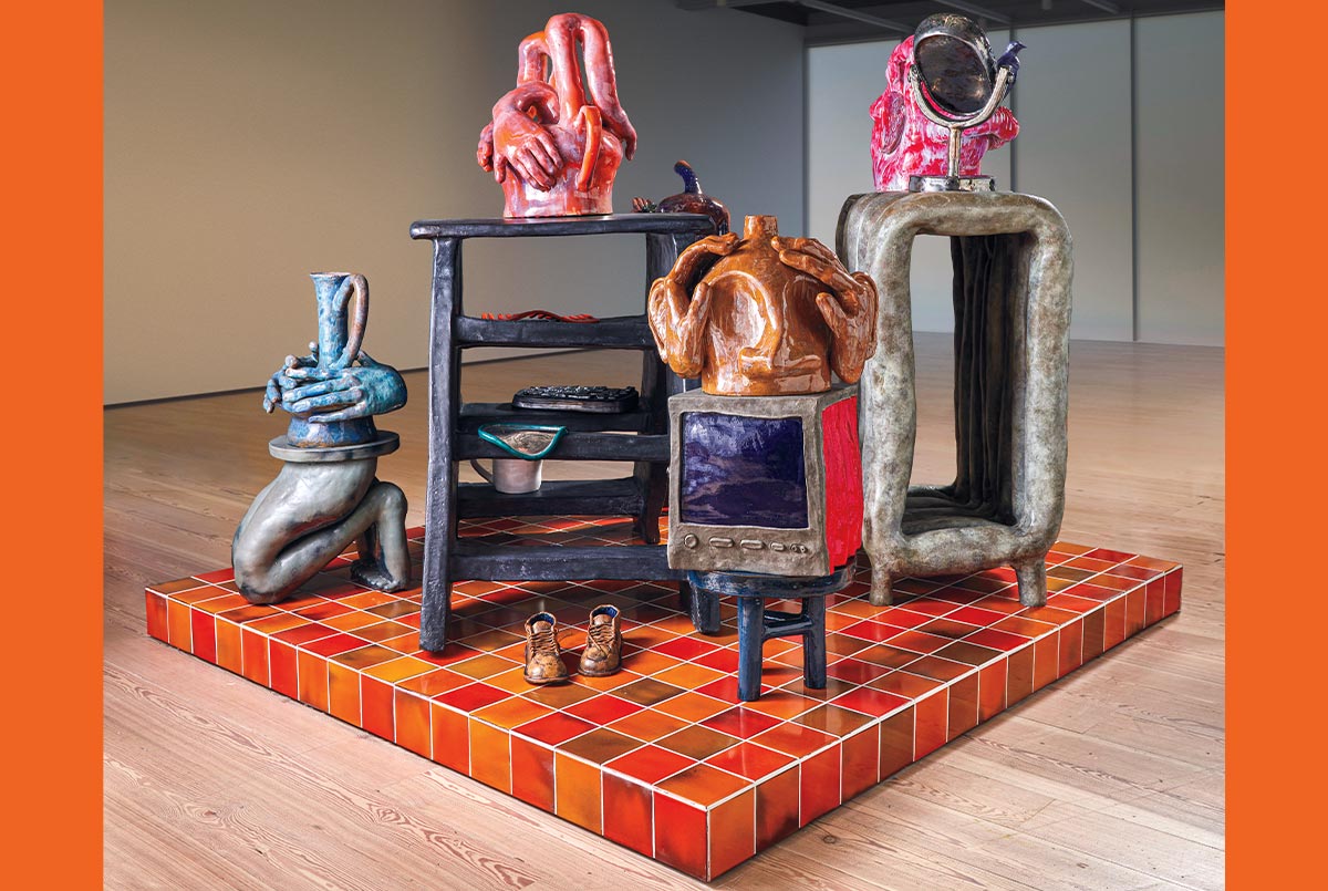 Image of a ceramics display of everyday objects and then abstract ones