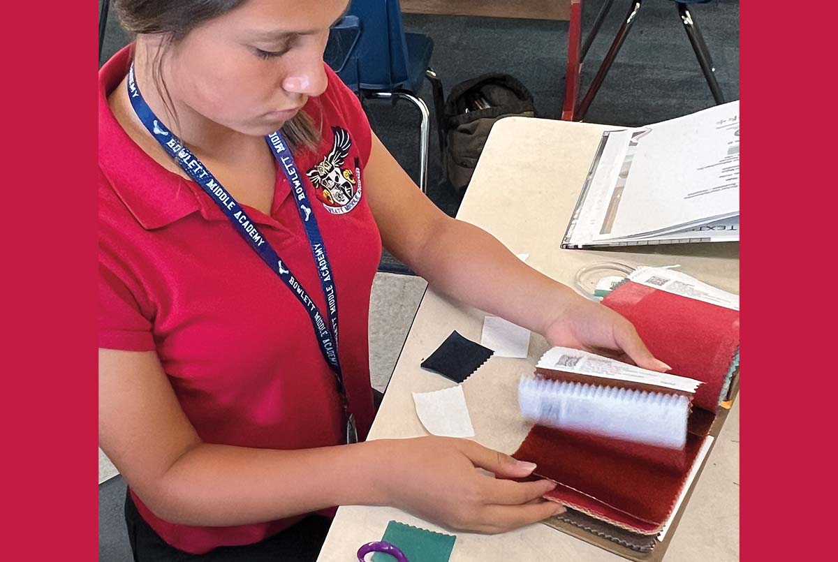Photo of a student looking through swatches