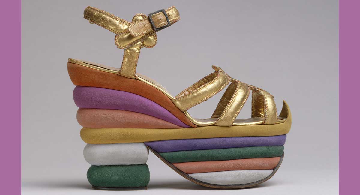 Image of a colorful high heel layered with rows of additional height