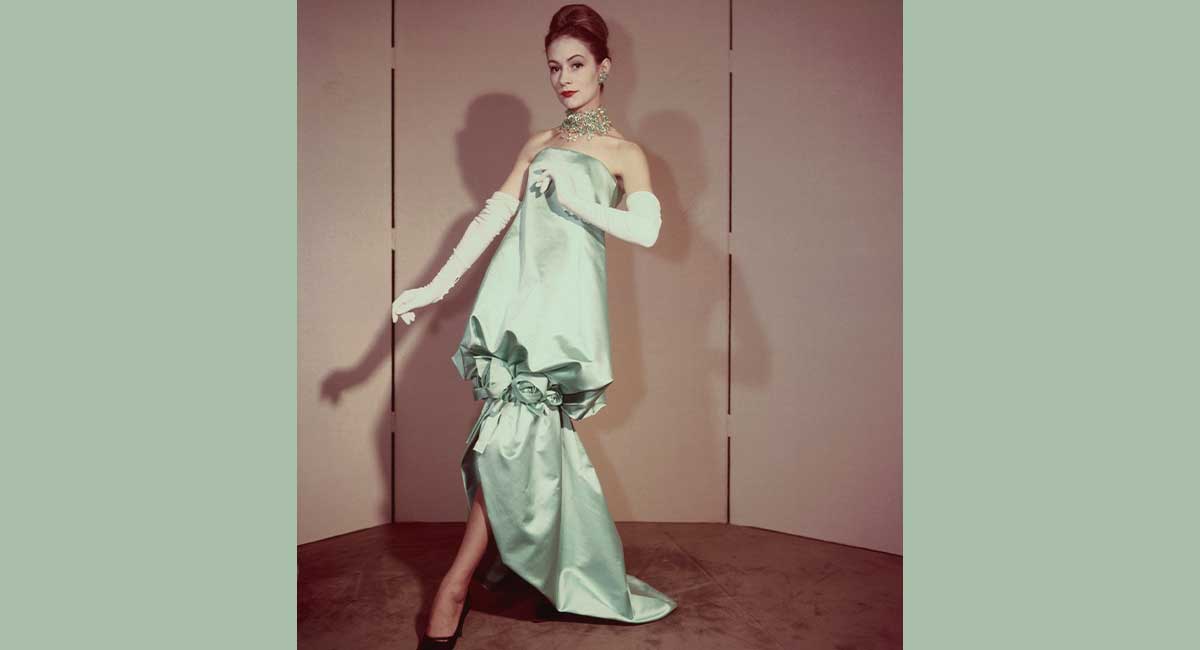 Image of a woman posing in a light green dress