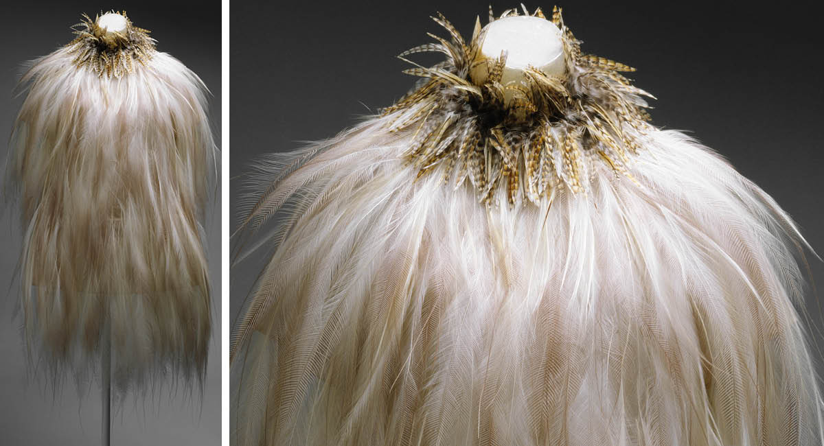 Image of a dress made out of feathers worn by a mannequin