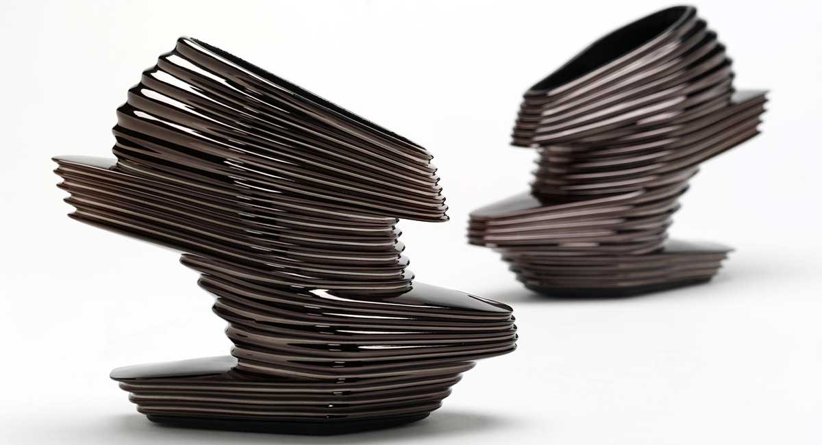 Image of silver high heels, stacked in thin strips of metal