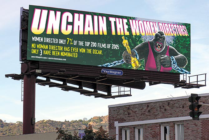 Enlargeable image of a billboard with a gorilla wearing a dress. Text, "Unchain the Women Directors"